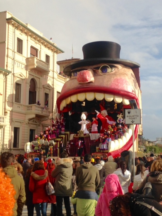 The floats are very tall and include a lot of dancers.